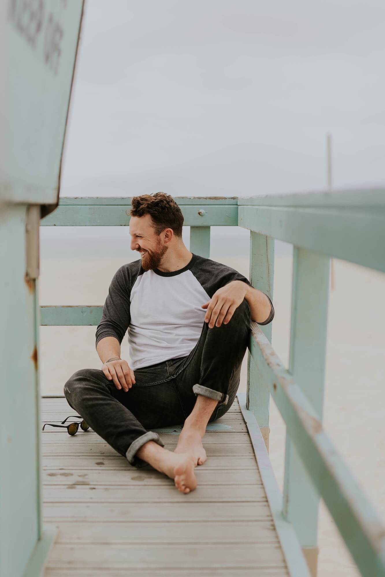 Man laughing on pier