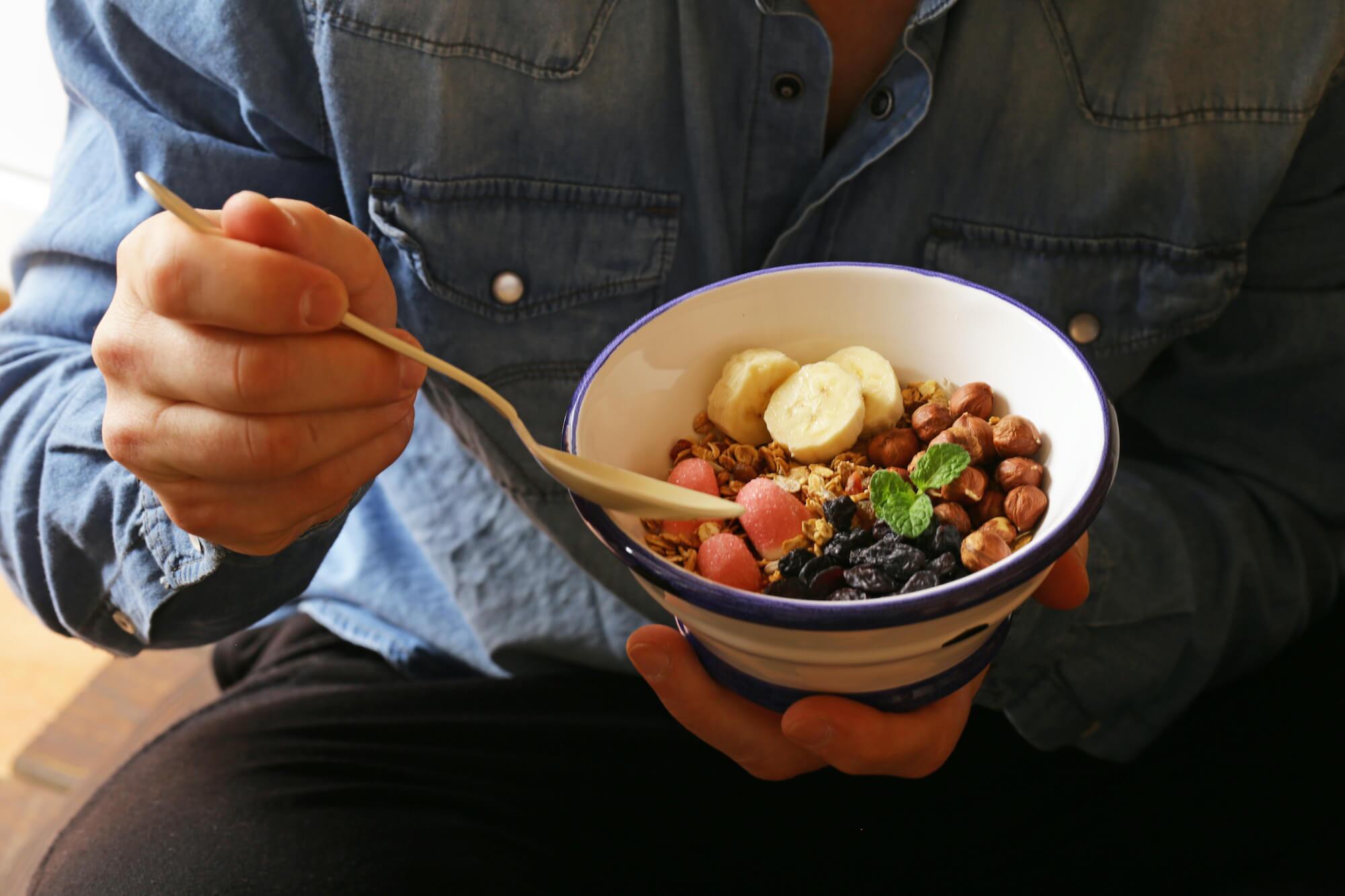 Cropped image of a man eating a healthy breakfast