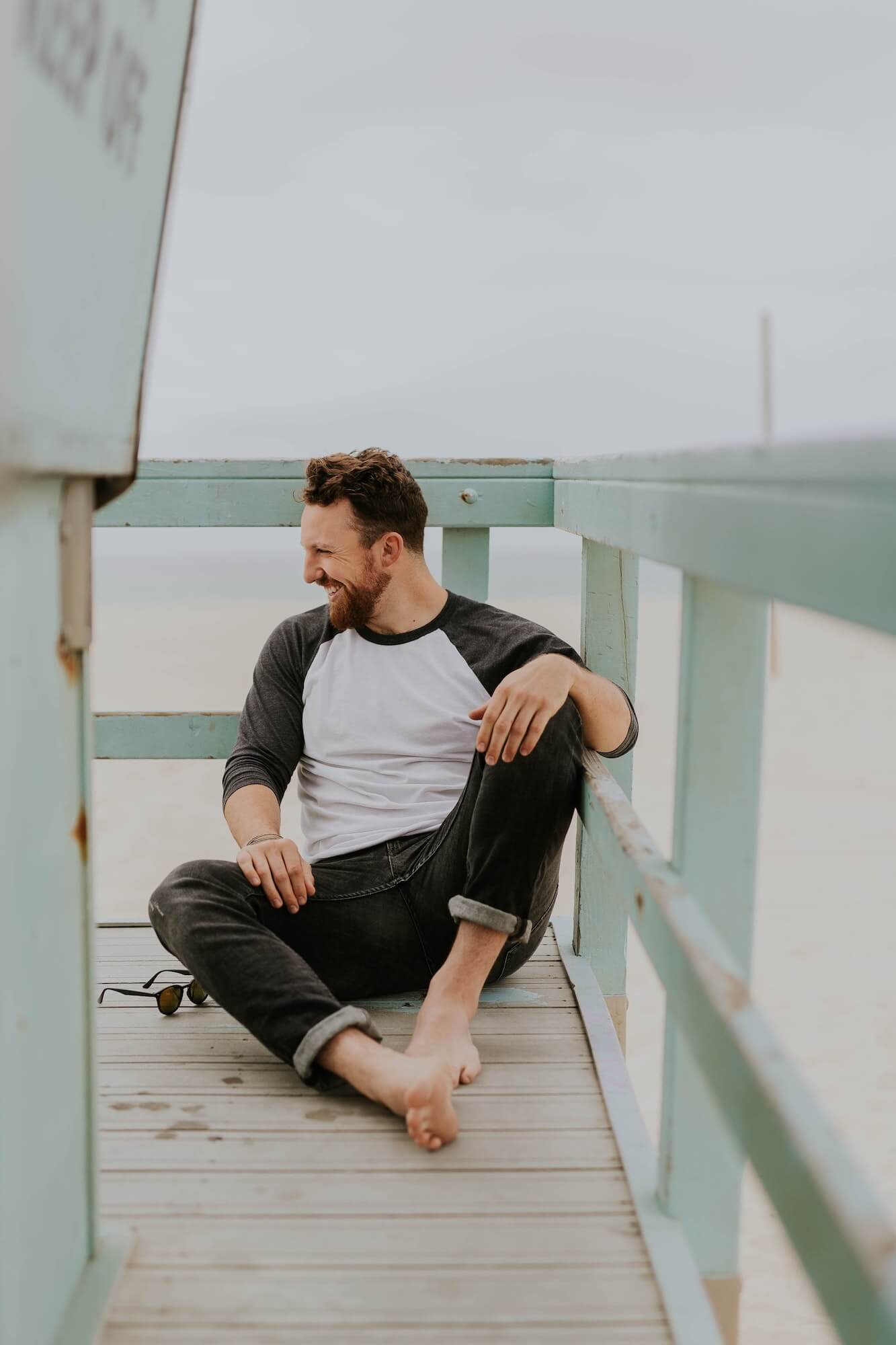 Man laughing on pier