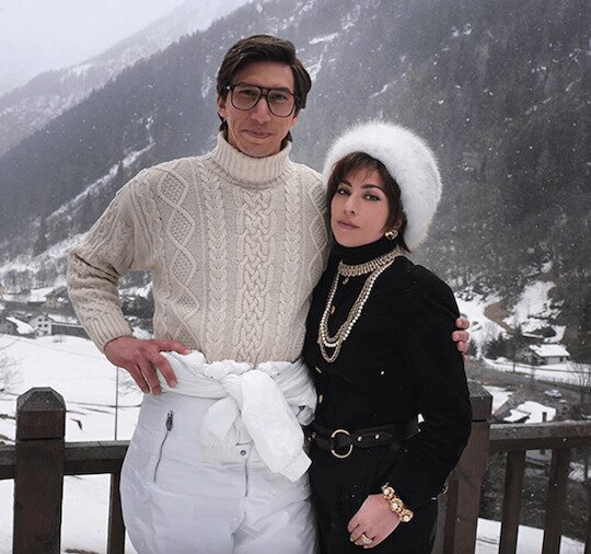 House of Gucci promo photo of Adam Driver and Lady Gaga in ski attire