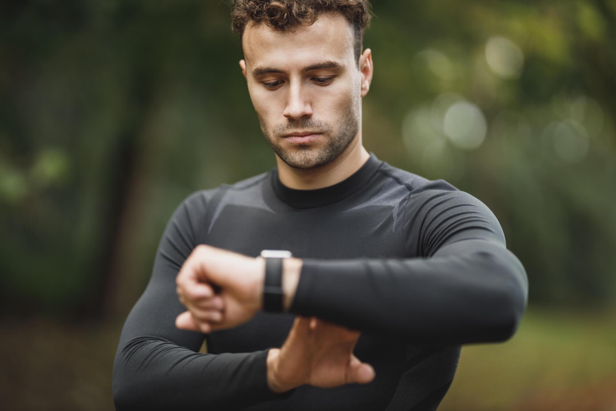 Man checking running watch