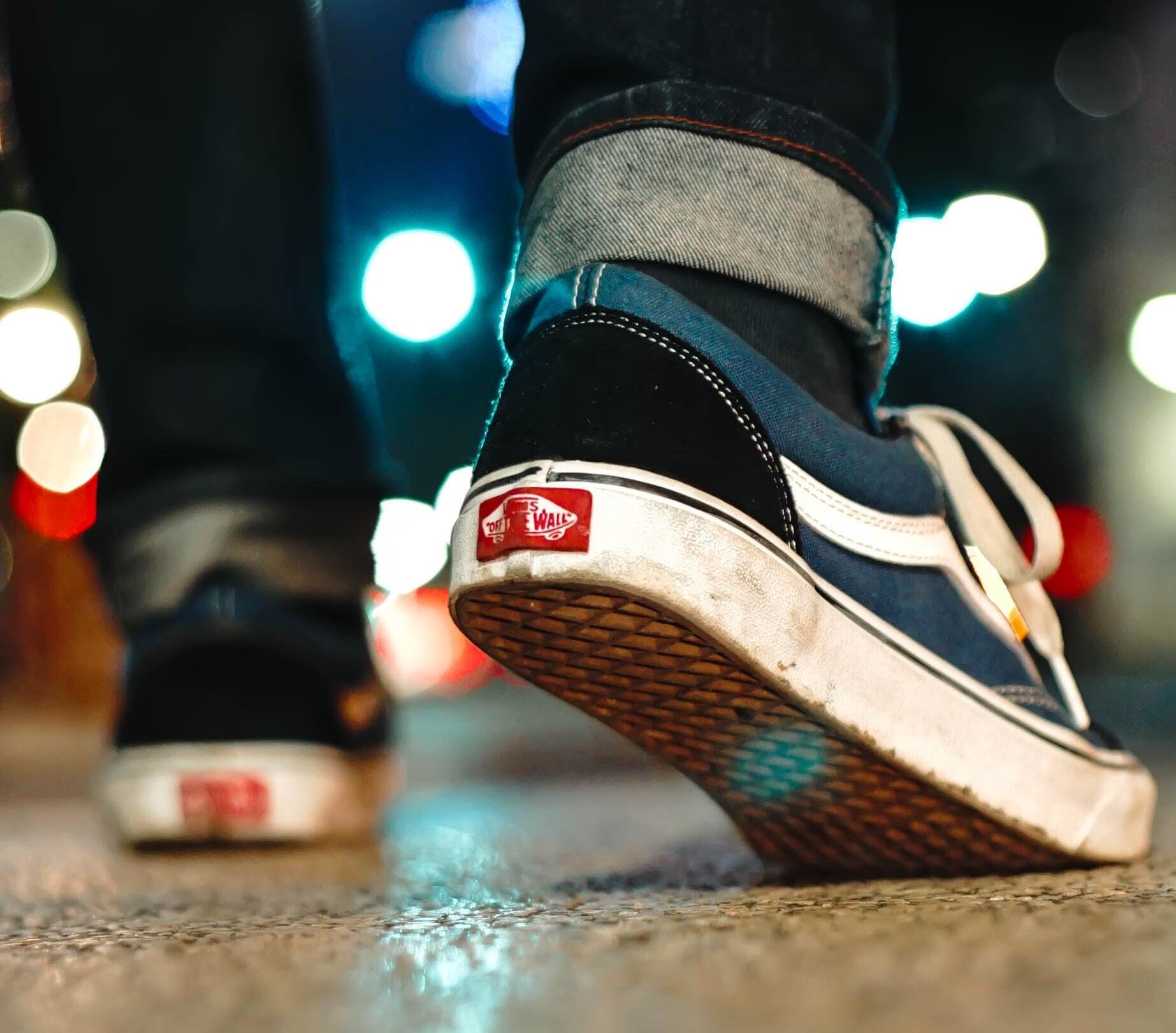 Close up of man wearing Vans Old Skool shoes