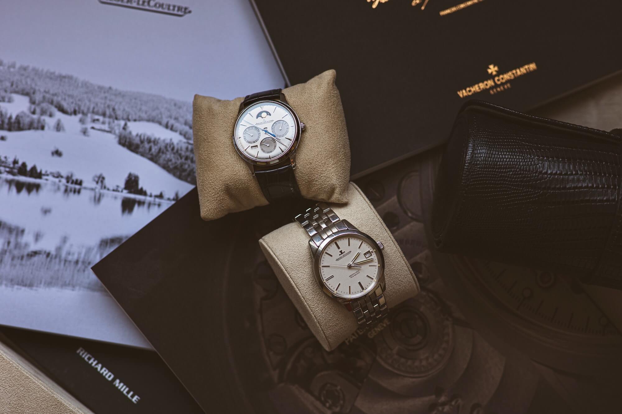 Two Jaeger-LeCoultre watches on cushions