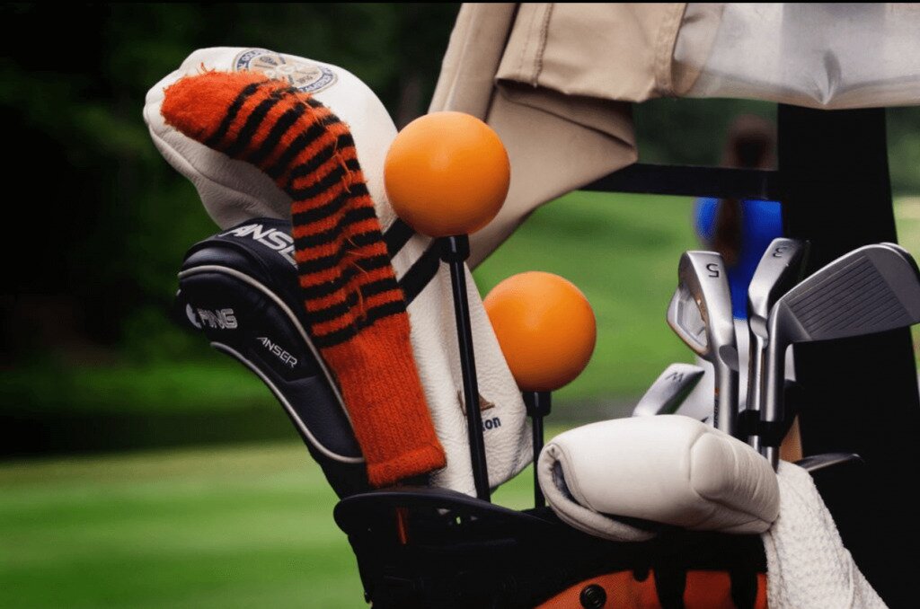 Orange Whip golf training aid in golf bag